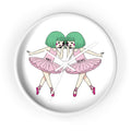 Aiko and Keiko dancing ballerina girls wall clock with pink tutus and green hair illustration.